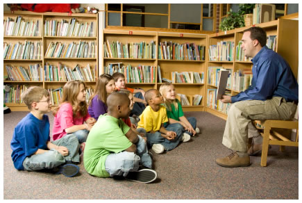 man-reading-to-kids-library